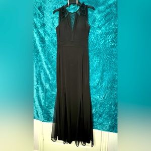 Long black v-neck dress with mesh.